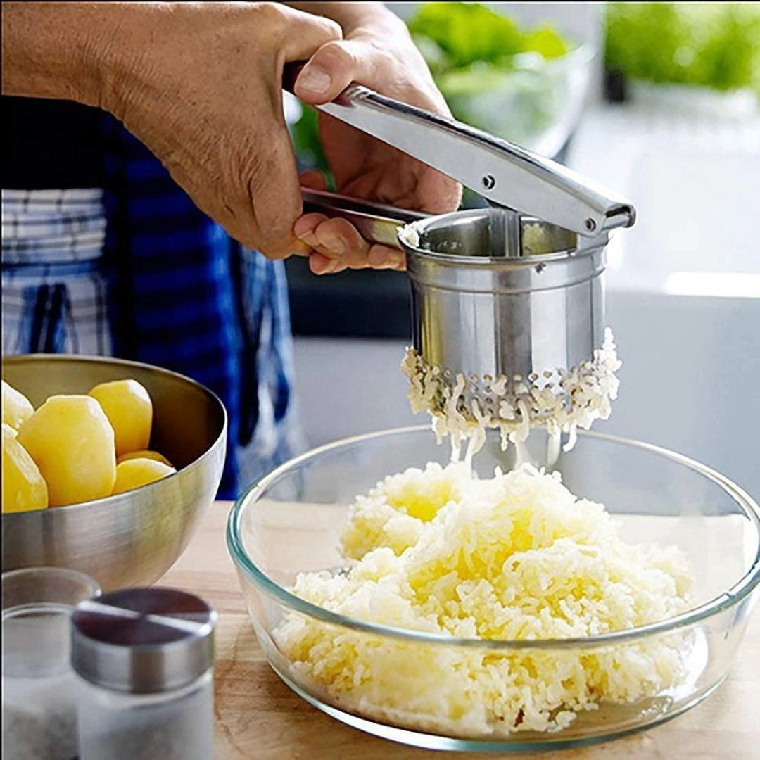 Squeezing lemon with steel citrus squeezer